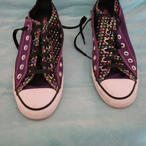 Purple and polka dot Converse shoes